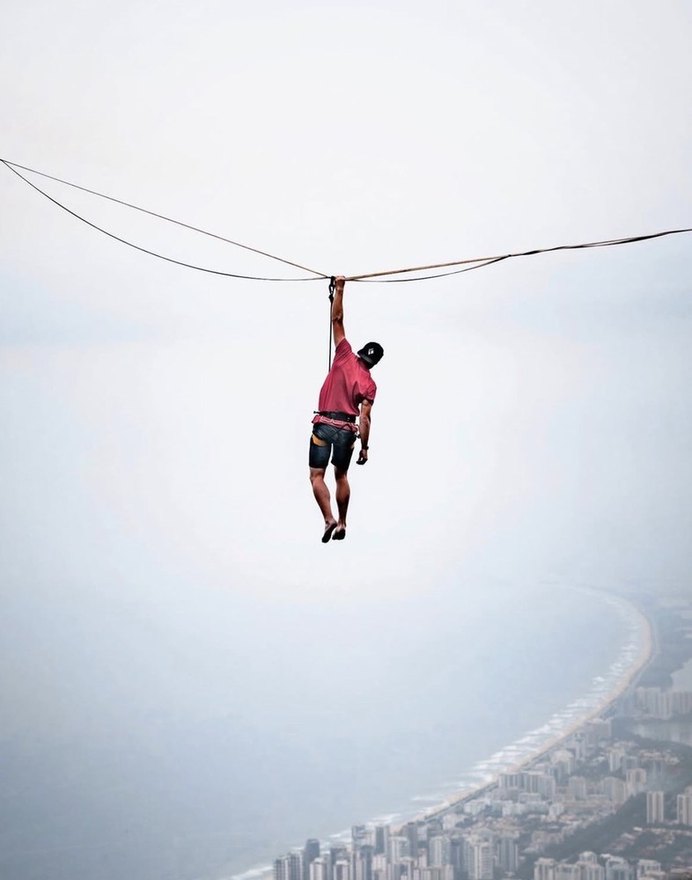 Hanging from a highline high above the coast