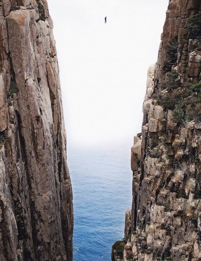 Highlining between sheer ocean cliffs